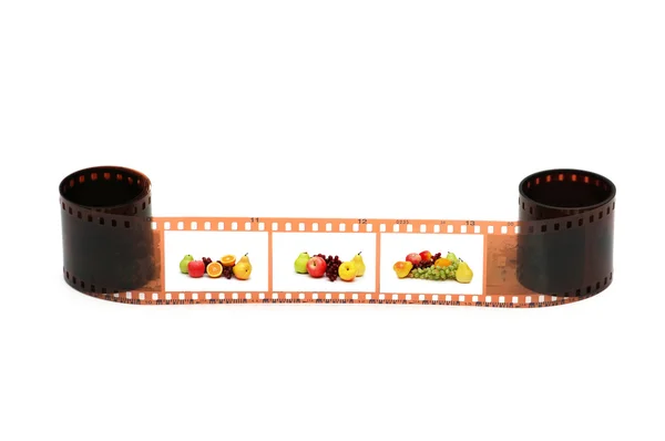 Filmrolle mit Fruchtbildern auf weiß — Stockfoto