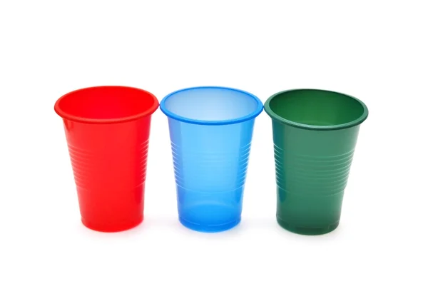 Três copos de plástico isolados no branco — Fotografia de Stock