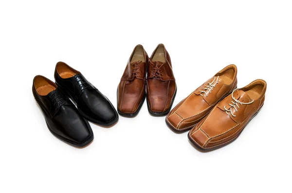 Três pares de sapatos isolados no branco — Fotografia de Stock