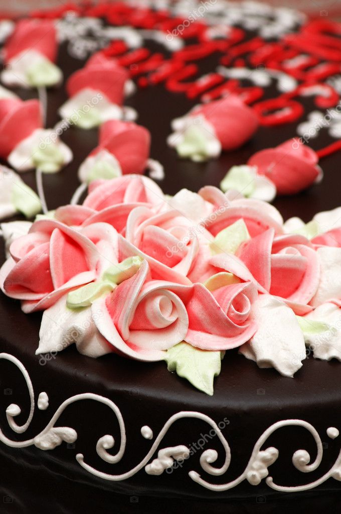 ケーキの上のバラ飾りのクローズ アップ ストック写真 C Elnur