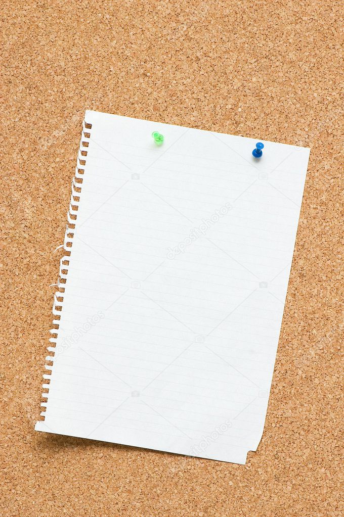 Blank page attached to corkboard with two pins