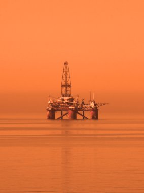 Oil rig in the Caspian Sea near Baku clipart