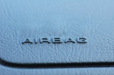 Airbag caption on the car leather dashboard clipart