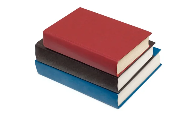 Три разноцветные книги, изолированные на белом — стоковое фото