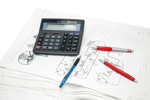 Design drawings, calculator and red pens — Stock Photo, Image
