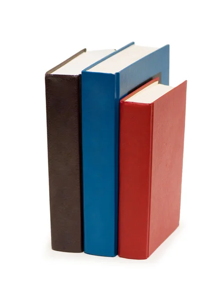 Tre libri colorati isolati sul bianco — Foto Stock