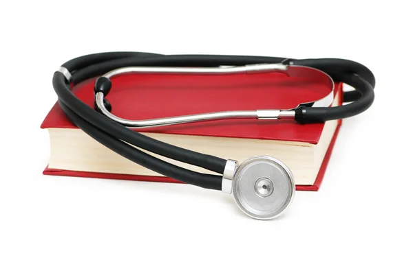 Stetoskop na Červená kniha izolovaných na bílém — Stock fotografie