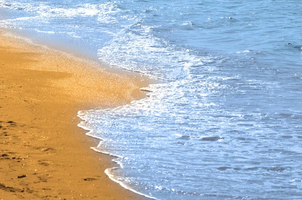 Eau et sable à la plage — Photo