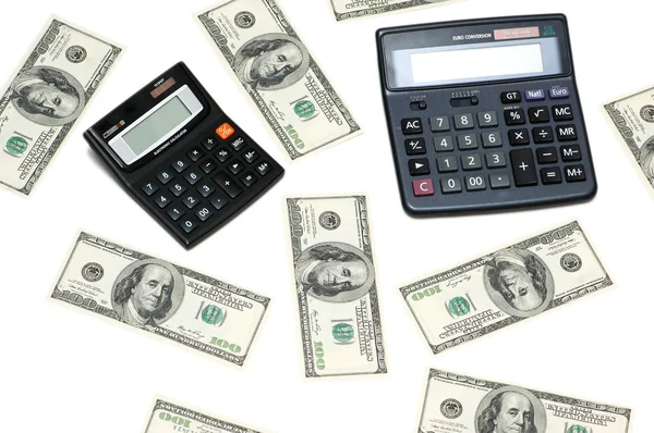 Dólares y calculadoras aislados en el blanco — Foto de Stock