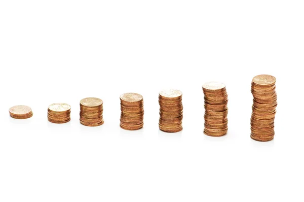 Pilhas de moedas isoladas no fundo branco — Fotografia de Stock