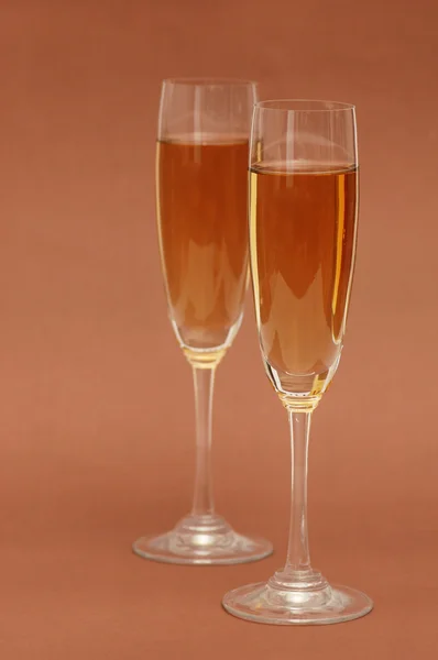 Two wine glasses on the biege background — Stock Photo, Image
