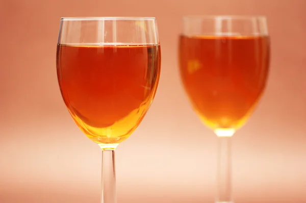 Two wine glasses on the biege background — Stock Photo, Image