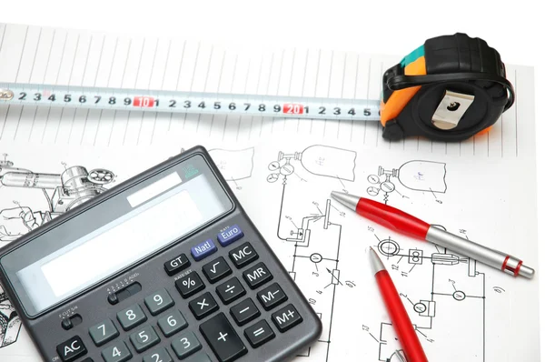 Calculator and pencils over the engineering drawings — Stock Photo, Image