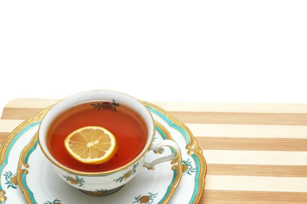 Xícara de chá com limão isolado no branco — Fotografia de Stock