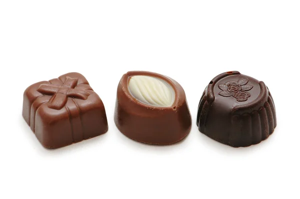 Три шоколада изолированы на белом фоне — стоковое фото