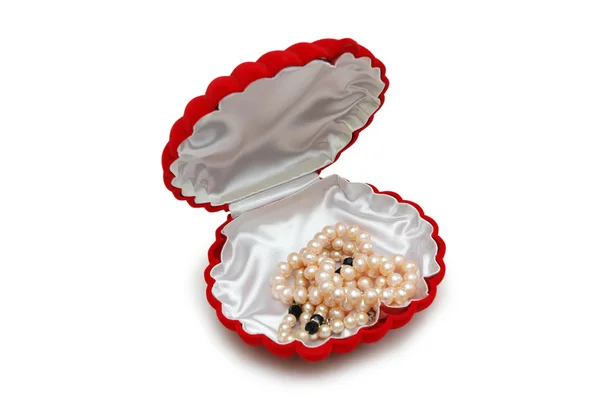 Red peal-shaped box with pearl beads isolated on white — Stock Photo, Image
