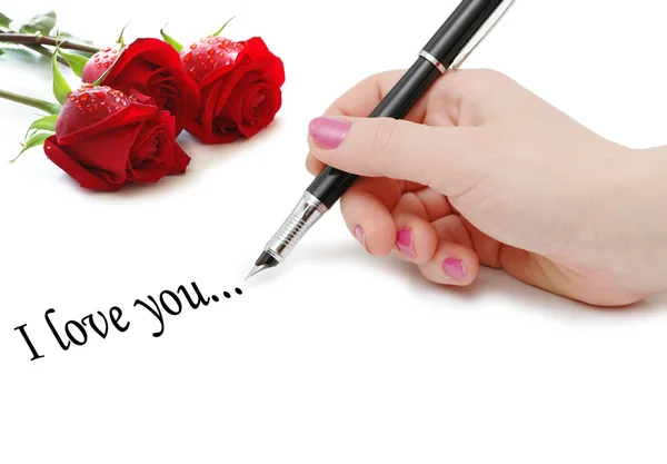 Eu te amo "mensagem com rosas e mão — Fotografia de Stock