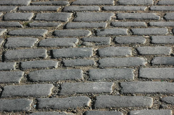 Cobbles en la calle - se puede utilizar como fondo — Foto de Stock