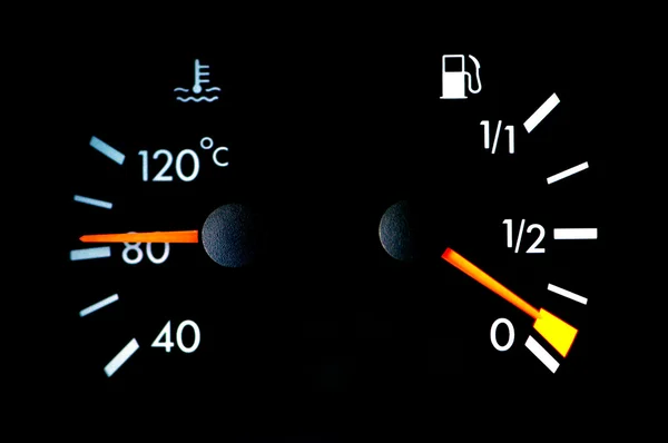 Petrol and temperature meters on car dashboard — Stock Photo, Image
