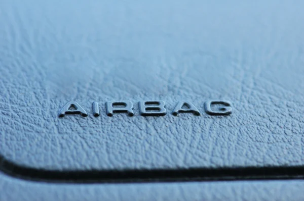 Airbag caption on the car leather dashboard — Stock Photo, Image