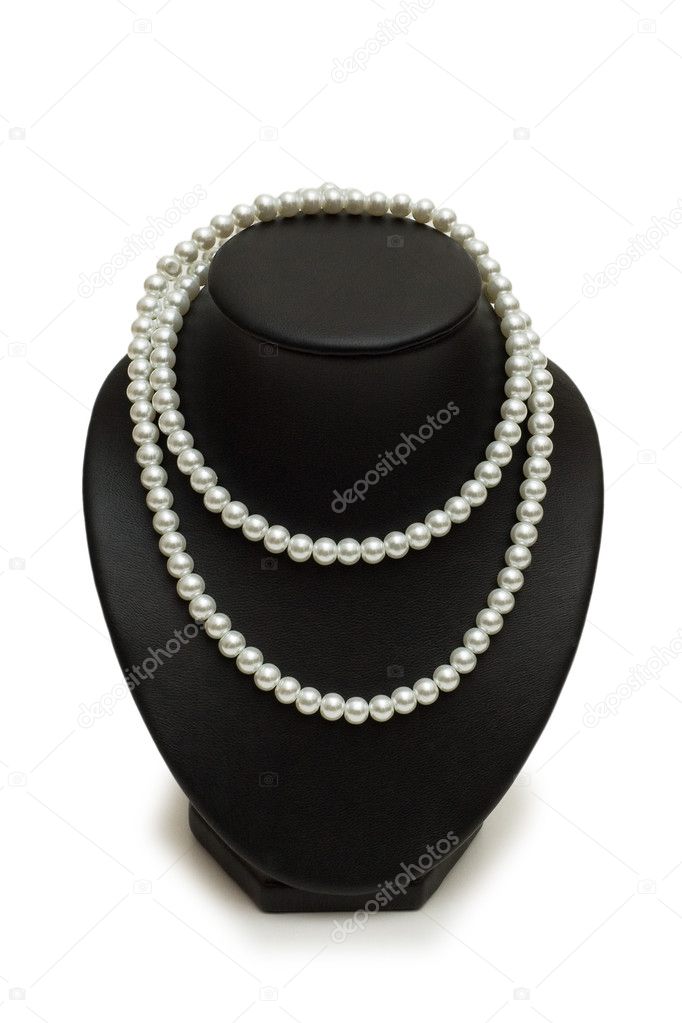 Pearl necklace on the stand isolated on white