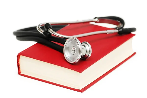 Stethoskop auf dem roten Buch isoliert auf weiß — Stockfoto