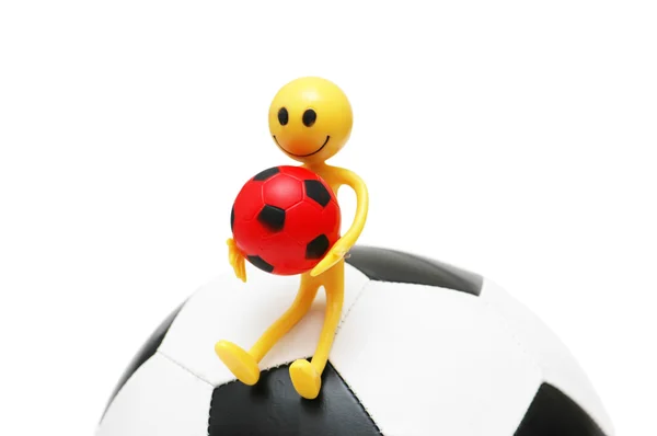 Smilie sitting on the football isolated on white — Stock Photo, Image
