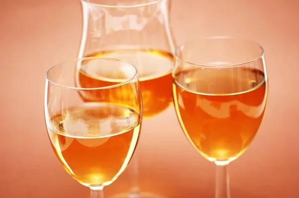 Three wine glasses on the biege background — Stock Photo, Image