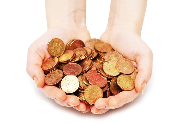 Manos sosteniendo muchas monedas aisladas en blanco — Foto de Stock