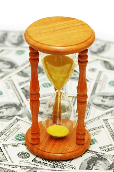 Tijd is geld"met dollar biljetten en zandloper — Stockfoto