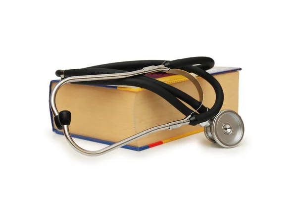 Concetto medico - Stetoscopio sul libro di testo medico — Foto Stock