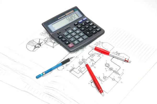 Pens and calculator over the engineering drawings — Stock Photo, Image