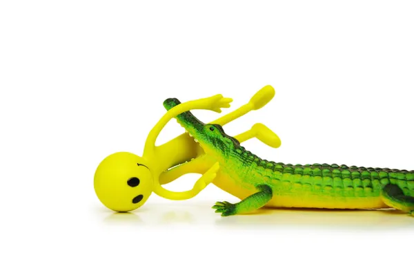 Krokodýl zabití smajlíka - izolované na bílém — Stock fotografie