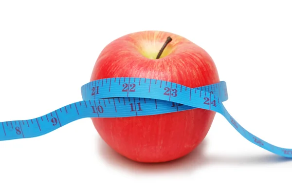 Red apple and measuring tape isolated on white Royalty Free Stock Photos