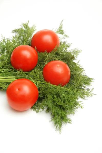 Tomates y hierbas aisladas sobre el fondo blanco Imágenes De Stock Sin Royalties Gratis