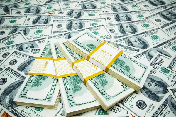 Pila di dollari su sfondo di soldi — Foto Stock