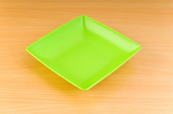 Empty plate on the wooden table — Stock Photo, Image