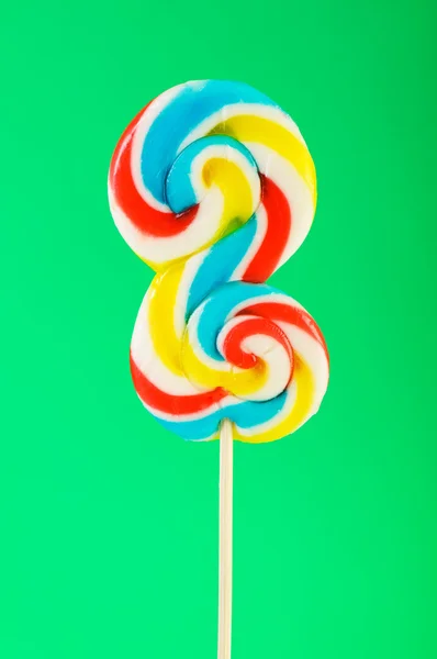 Colourful lollipop against the colourful background Royalty Free Stock Images