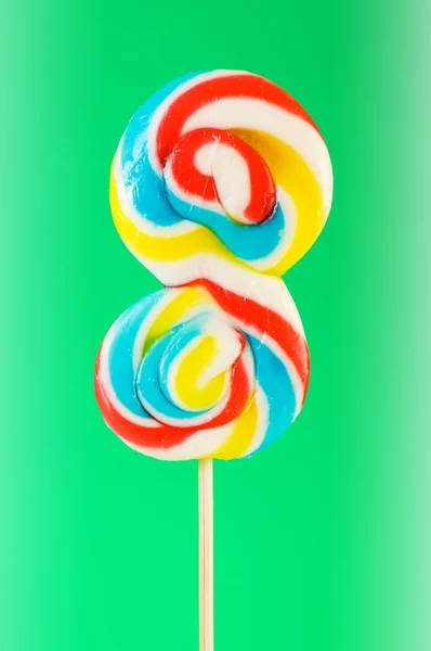 Colourful lollipop against the colourful background Royalty Free Stock Photos