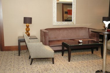 Lobby of the hotel with sofas and chairs clipart