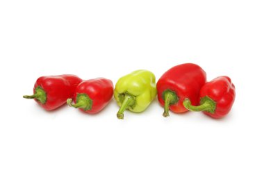 Green Pepper standing out from the crowd of red peppers clipart