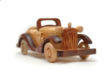 Wooden retro car model isolated on white clipart
