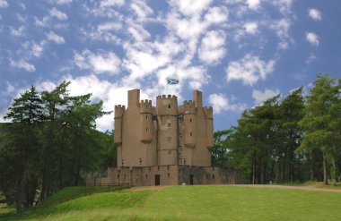 Scottish castle in the forest clipart