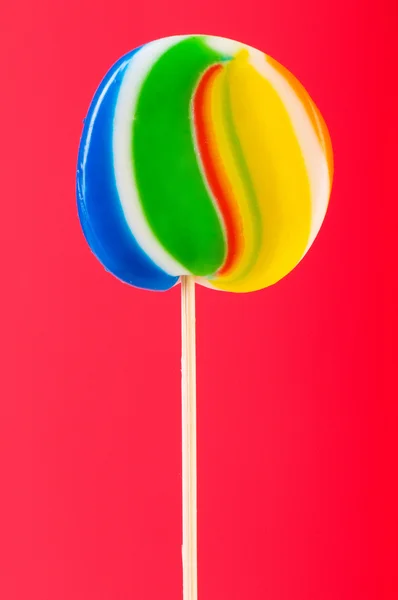 在色彩缤纷的背景色彩缤纷棒棒糖 — 图库照片