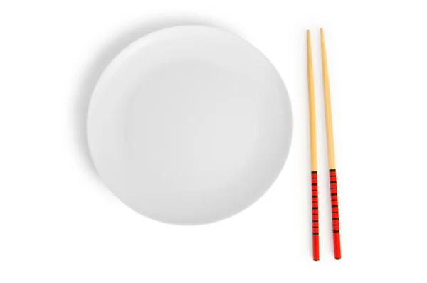 Conceito de comida asiática com prato e pauzinhos — Fotografia de Stock