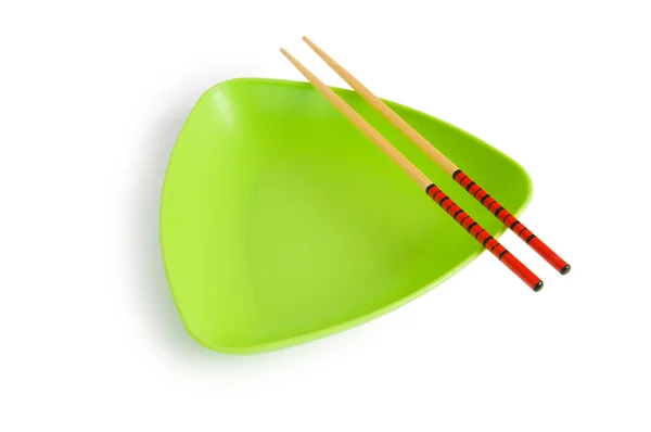 Concepto de comida asiática con plato y palillos — Foto de Stock