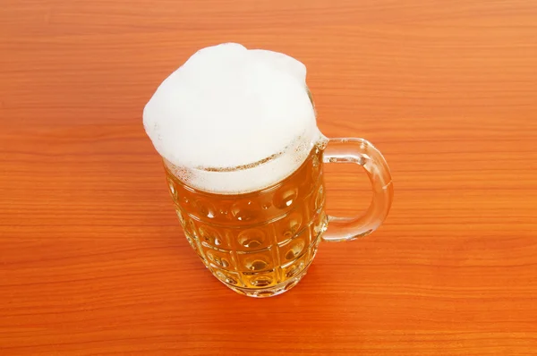 Beer glass on the wooden table — Stock Photo, Image