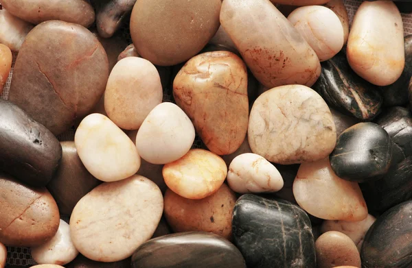 Kieselsteine in verschiedenen Formen - können als Hintergrund verwendet werden — Stockfoto