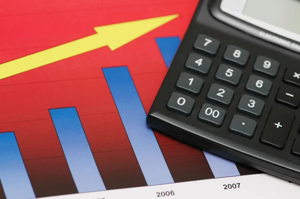 Close up of chart showing growth and calculator — Stock Photo, Image