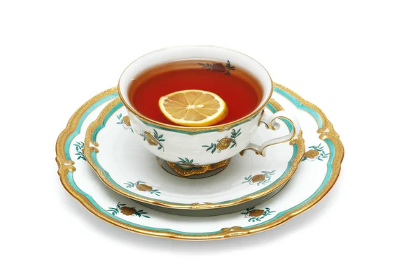 Xícara de chá com limão isolado em branco — Fotografia de Stock